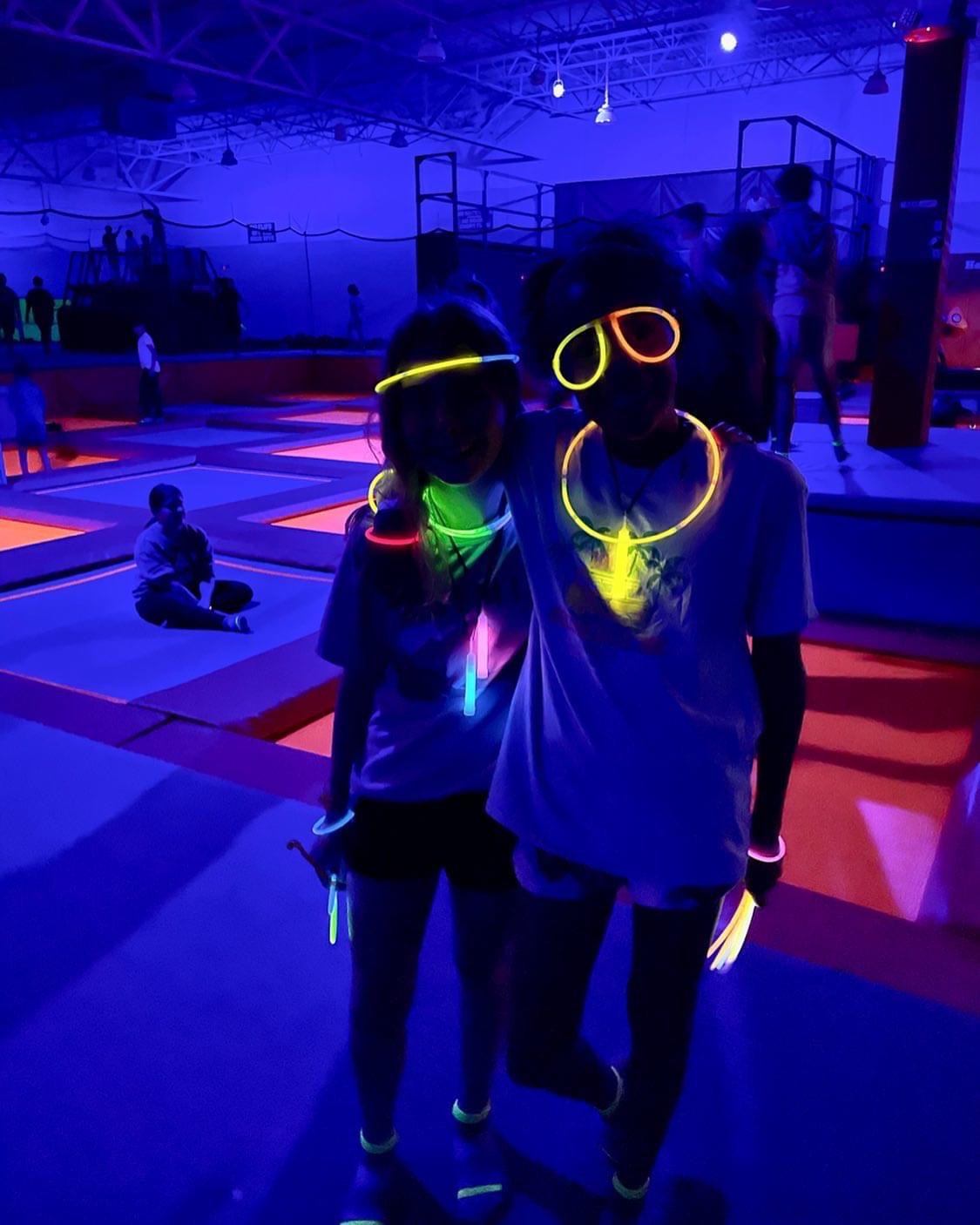 Guests at Ground Control OKC Glow Night wearing neon glow accessories